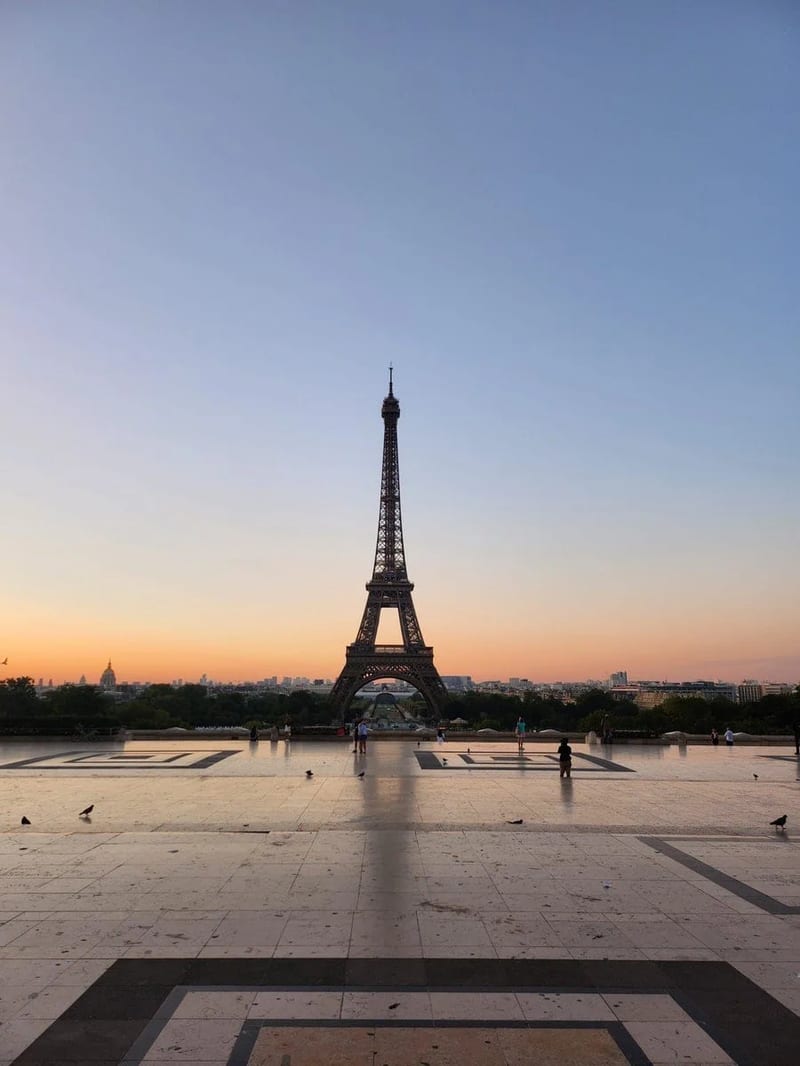 Eiffel Tower at sunrise over an empty Paris esplanade